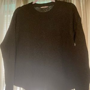 Green knit sweater with side embellishments